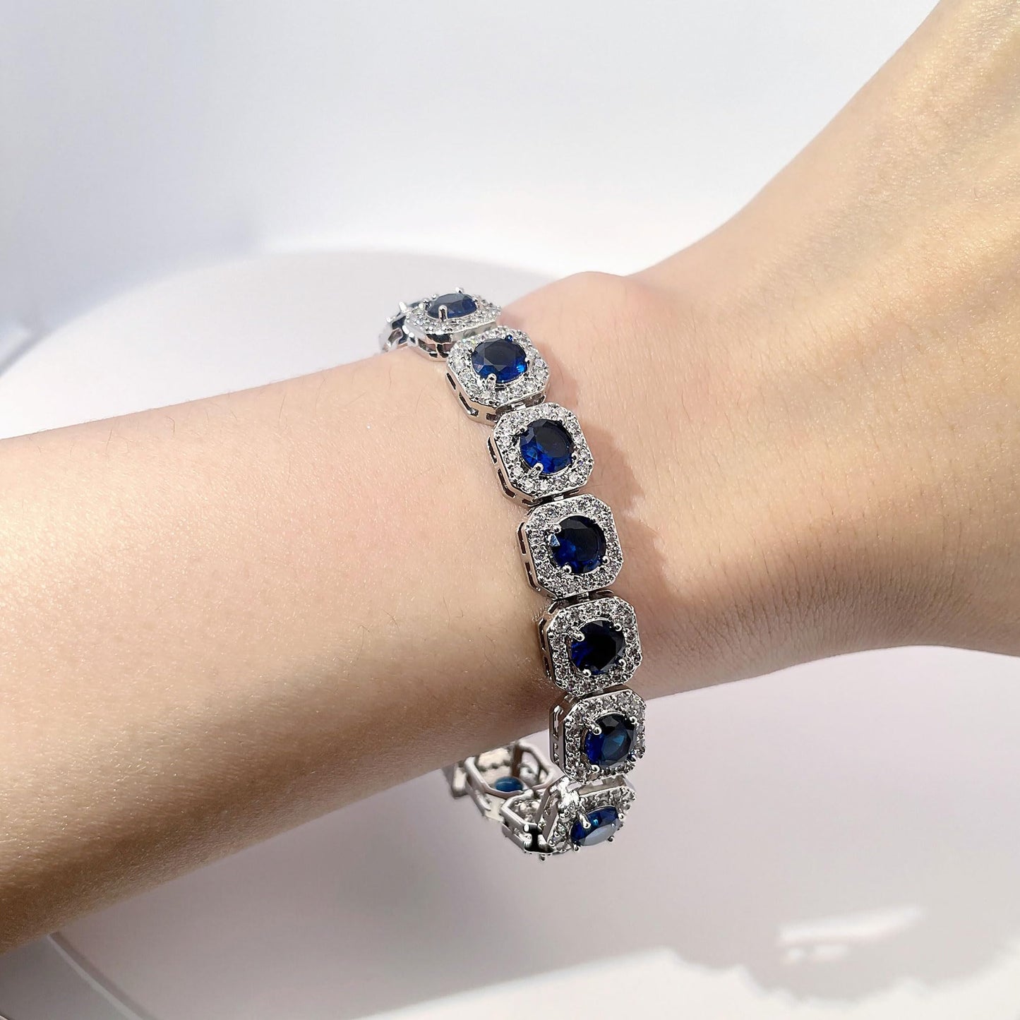 Warm Fortune Blue Halo Stone Tennis Bracelet for Women, Silver-Tone 7 Inch Statement Link Jewelry with Sparkling Pave Accents